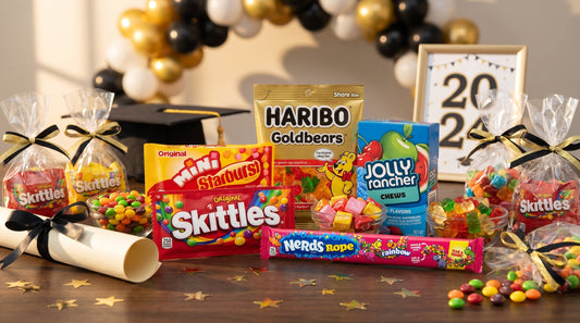 Graduation party candy table with real packaged candy favorites in a warm celebratory scene
